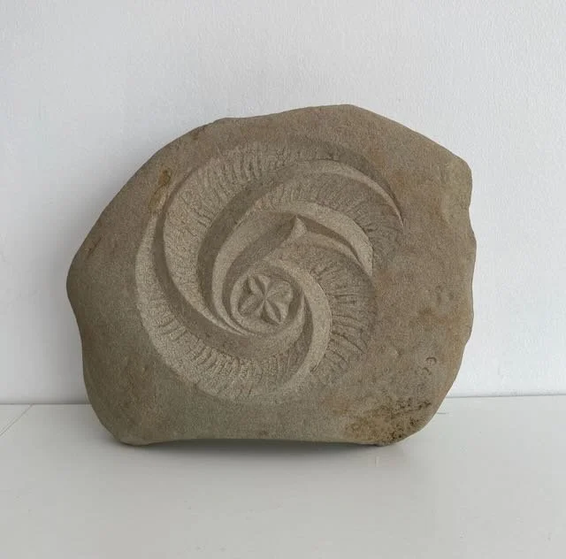 Peka Piko III  'spiral branch' hand carved in found stone. 25cm x 20cm, with metal dowel provided for wall hanging. 2 of 4 available. $350