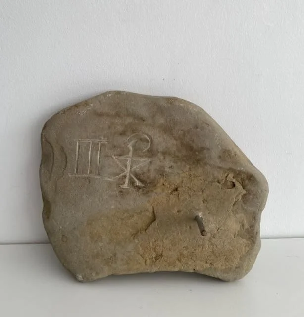 Reverse of Peka Piko, III 'spiral branch' hand carved in found stone. 25cm x 20cm, with metal dowel provided for wall hanging. 2 of 4 available. $350