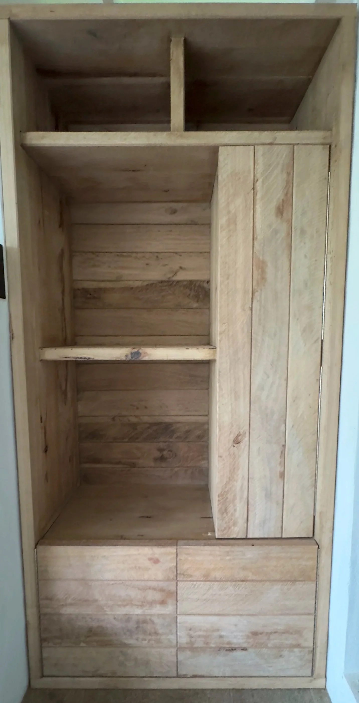 Hardwood cabinet with shelves and drawers for outdoor use.