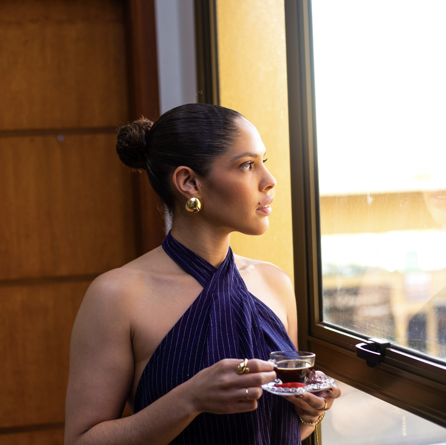 She drinks tea like  a woman with options.