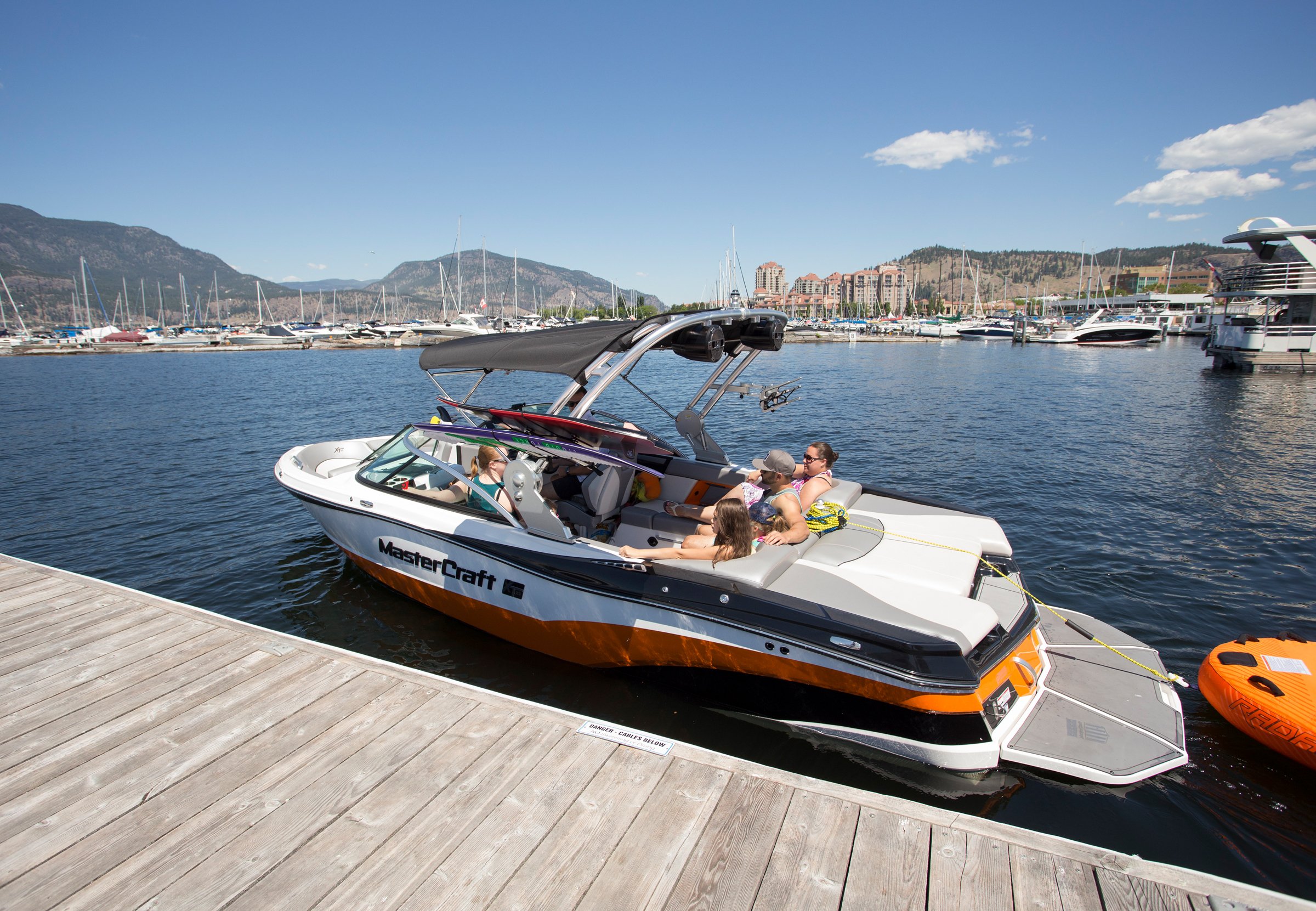 Boats docked at a Kelowna marina. Interior Abatement offers specialized rodent remediation for boats and personal watercraft during winter storage.