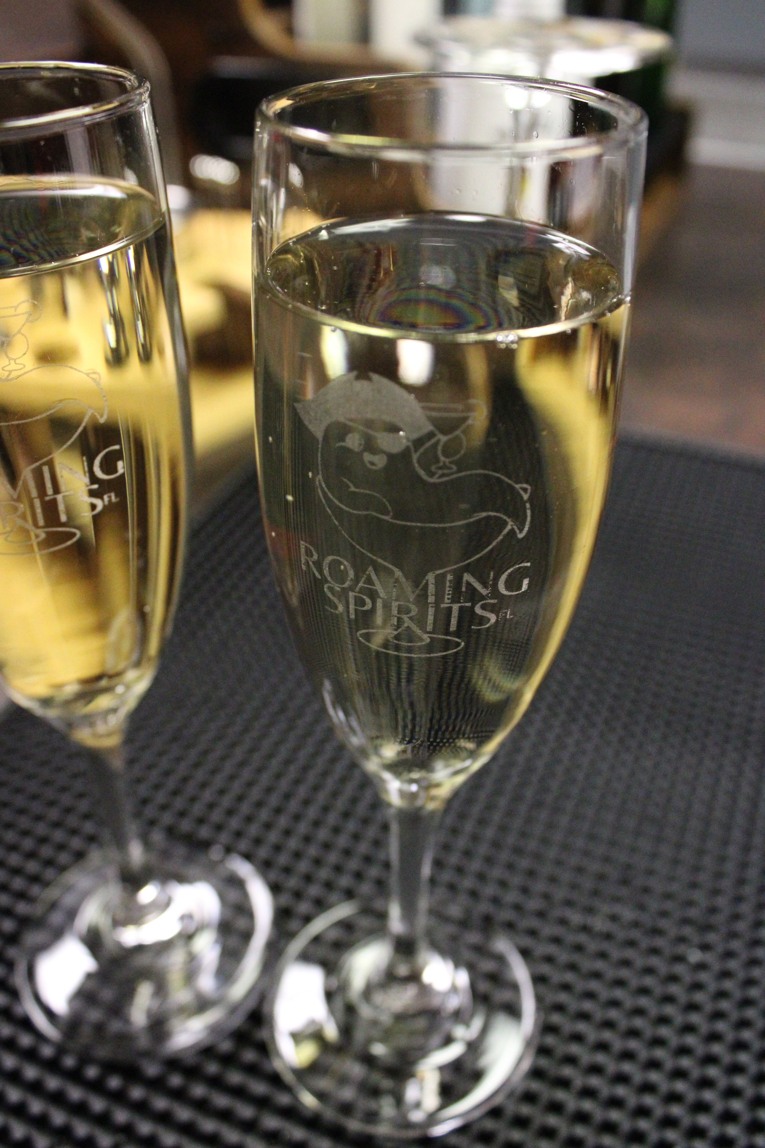 2-Filled-Champagne-Flute-RoamingSpirits-Logo.JPG