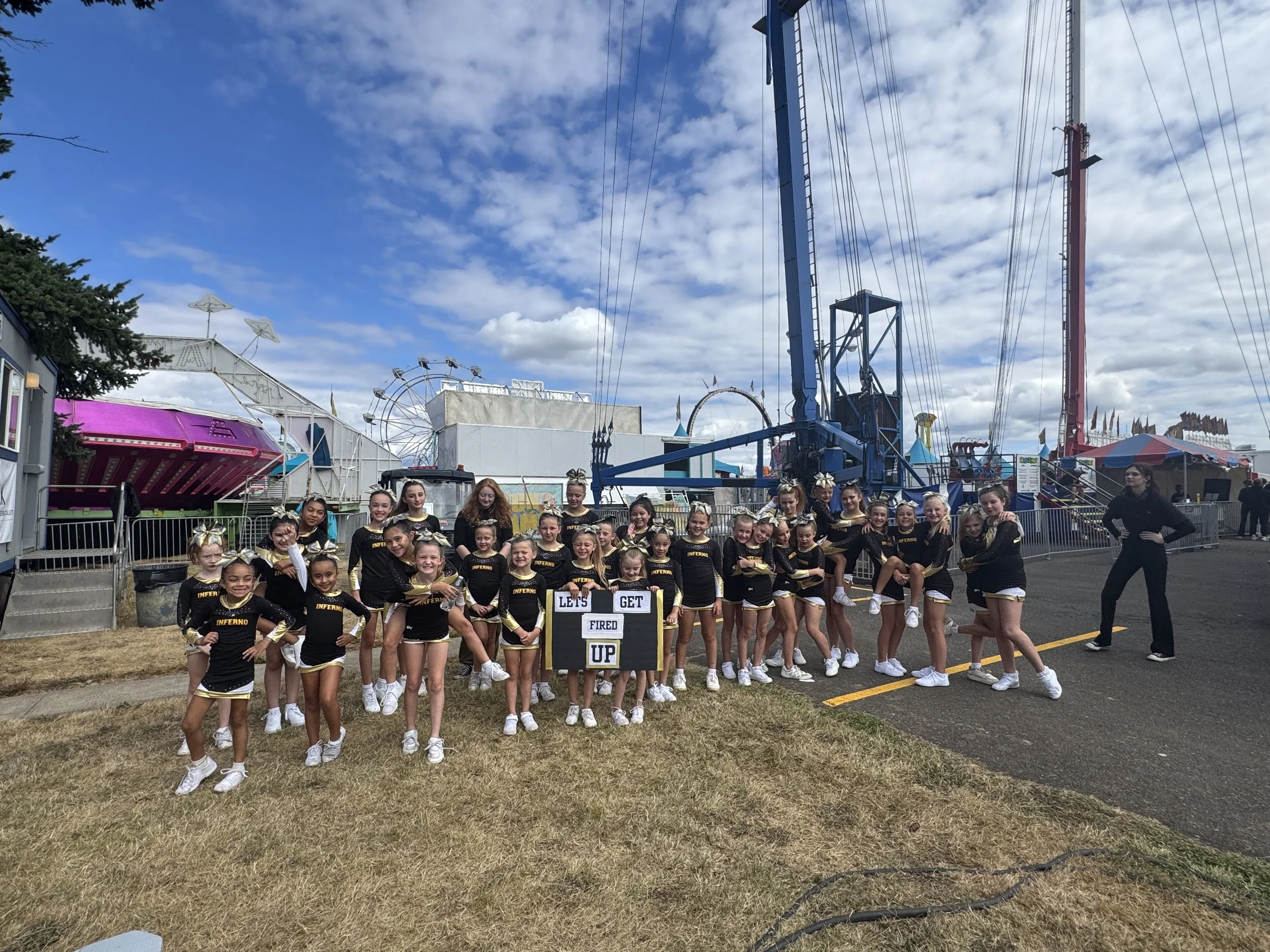 cheerleaders at Clark County Fair performing cheer routine in summer. Youth Cheerleading Organization from Camas Washougal.