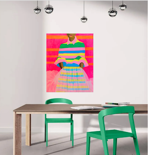 Dark-skinned woman in a brightly colored striped blouse and tulle skirt.