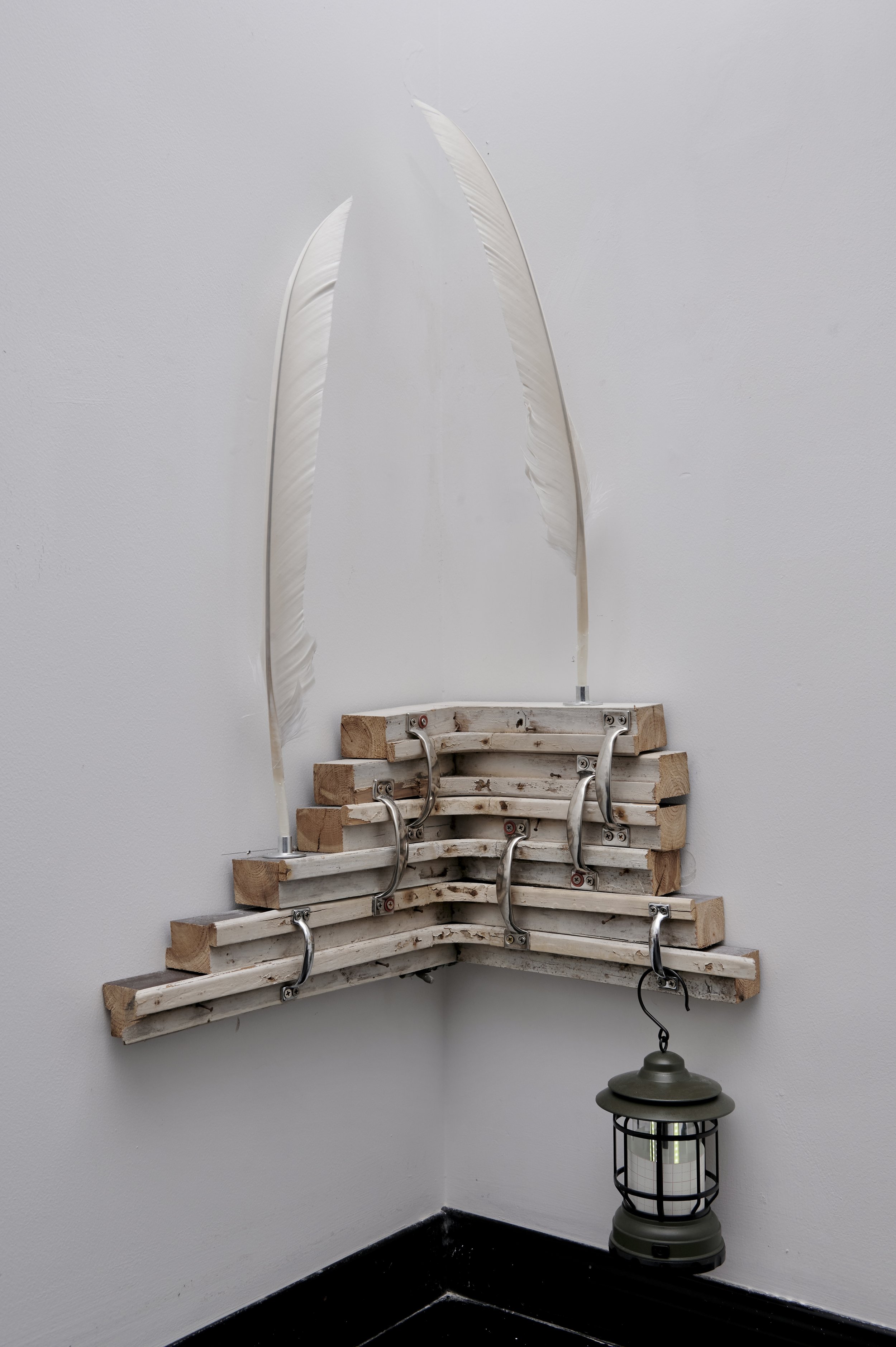 
Skirting, 2025, 45x43x80cm, Window Frame, Door Handle, Eagle Feathers, Pipe Clamp, Lantern, Calligraphy Paper and Washers