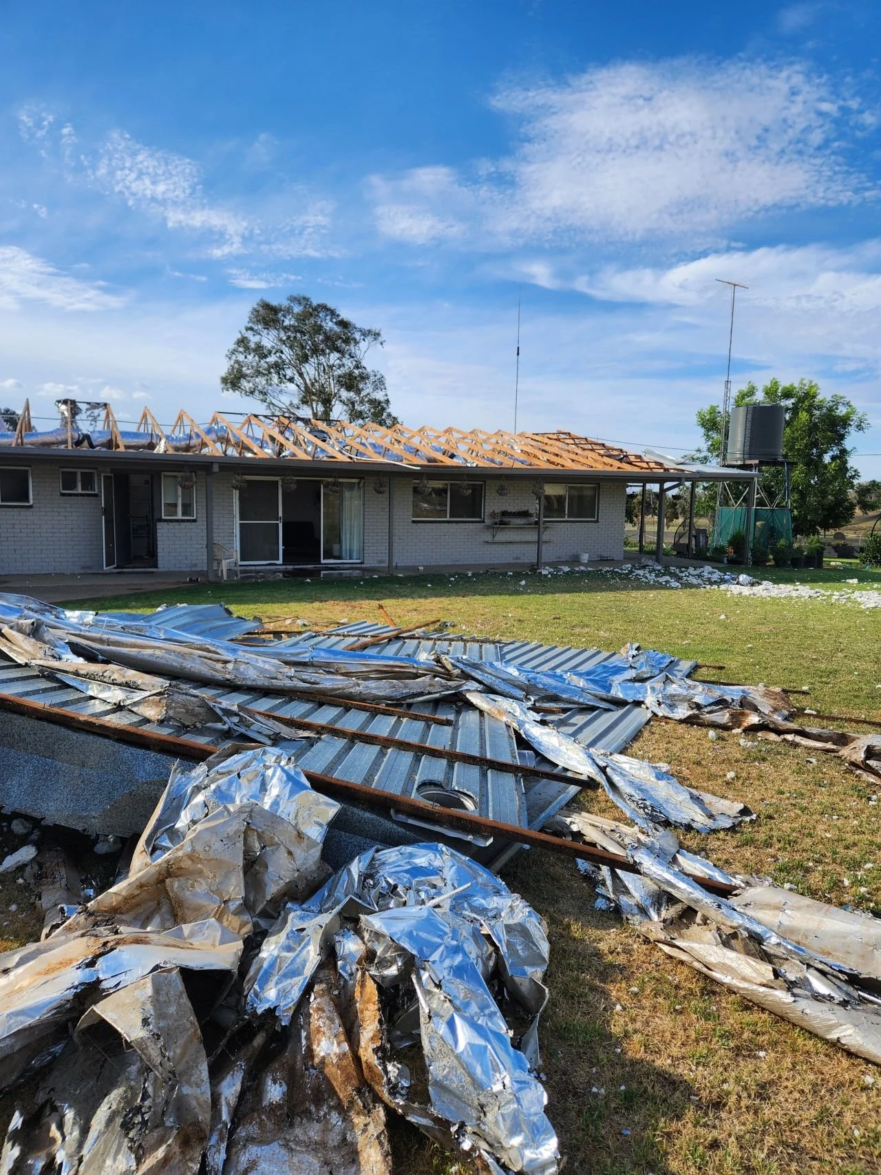 Oranssi technician working on a roof project