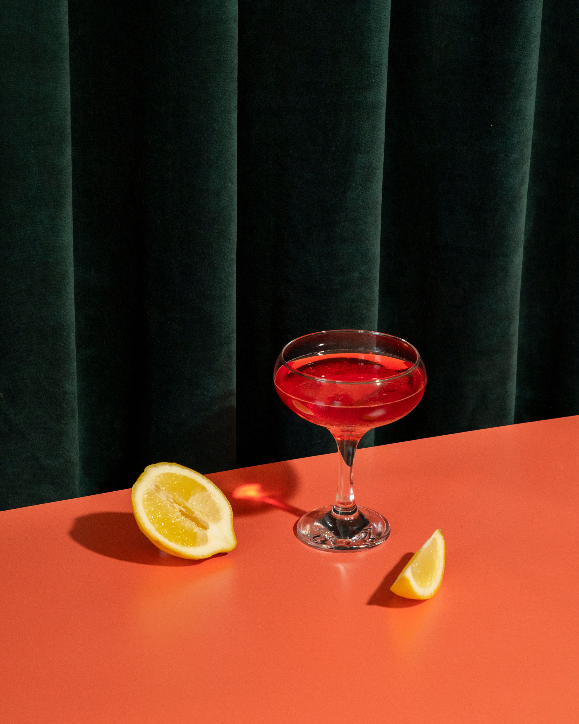 aperol, cocktail with lemons on a table for an event, dressing room curtin in background