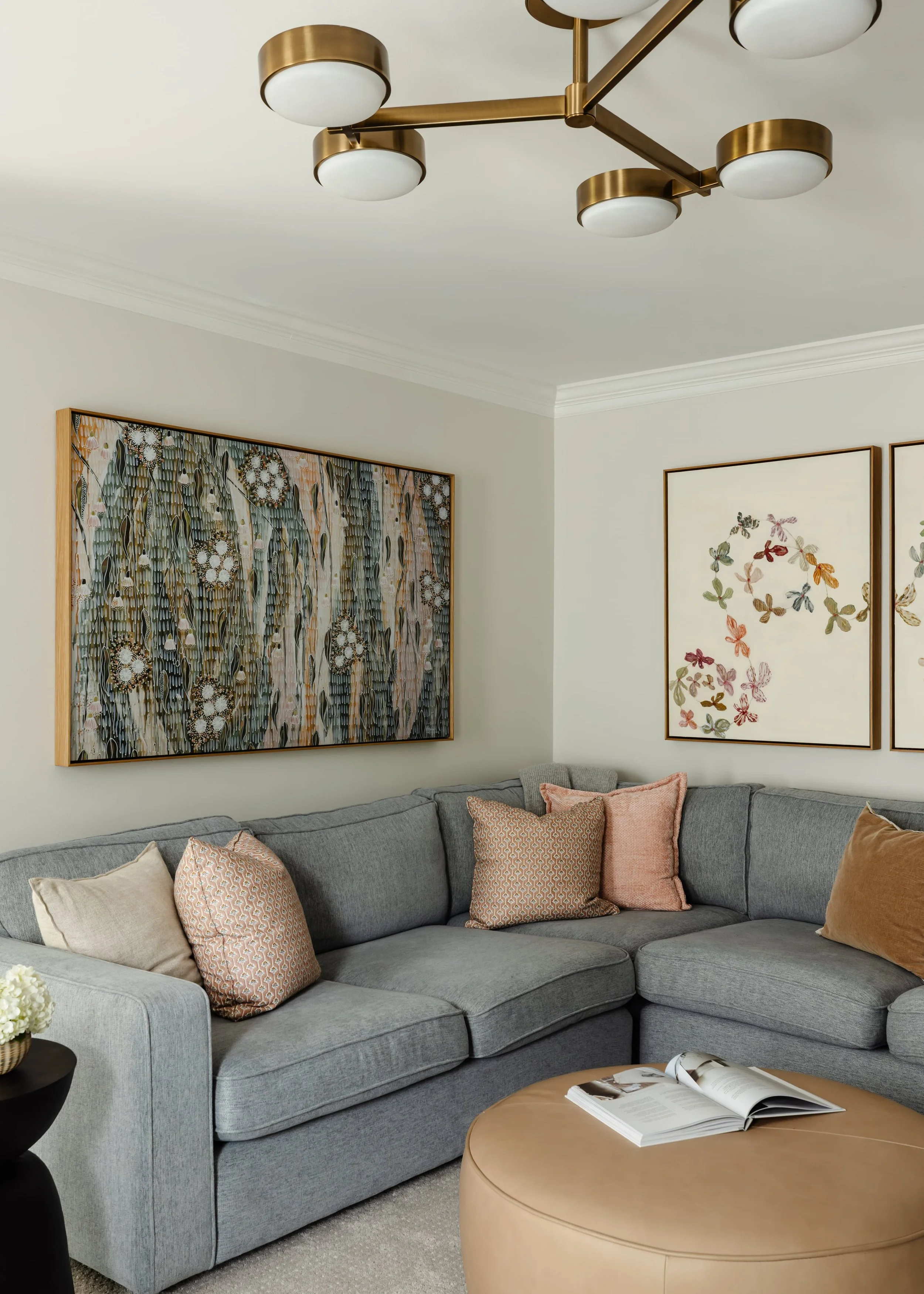 Warm, layered family room interior in a Cincinnati home by Mysa Home Design