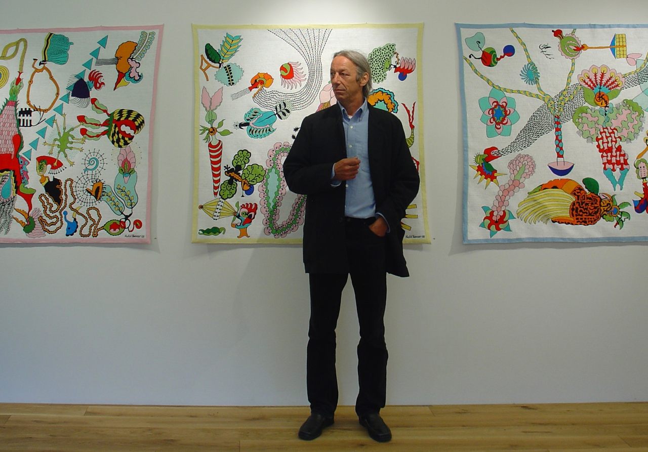 Ficht Tanner in front of some of his embroideries at the group exhibition "Nadelsausen" in Austria, Galerie in der Poststelle, Schwarzenberg, June 2008