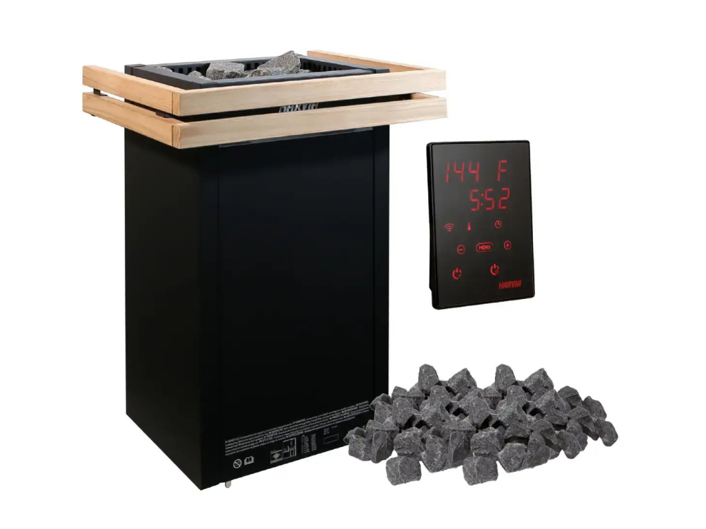An infrared sauna heater with a wooden top, a digital control panel displaying 144°F and 5:52, and a pile of rocks in front.