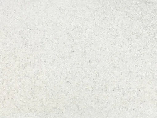 A blank, textured off-white surface or wall