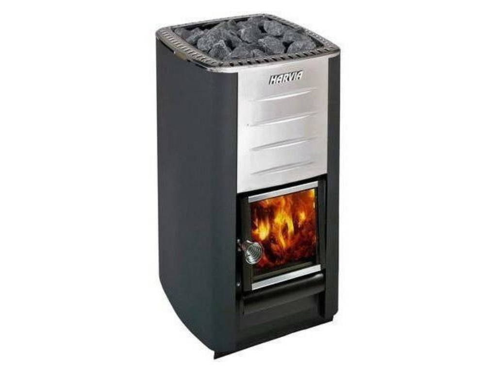 A sauna heater with a fire visible through the glass door.