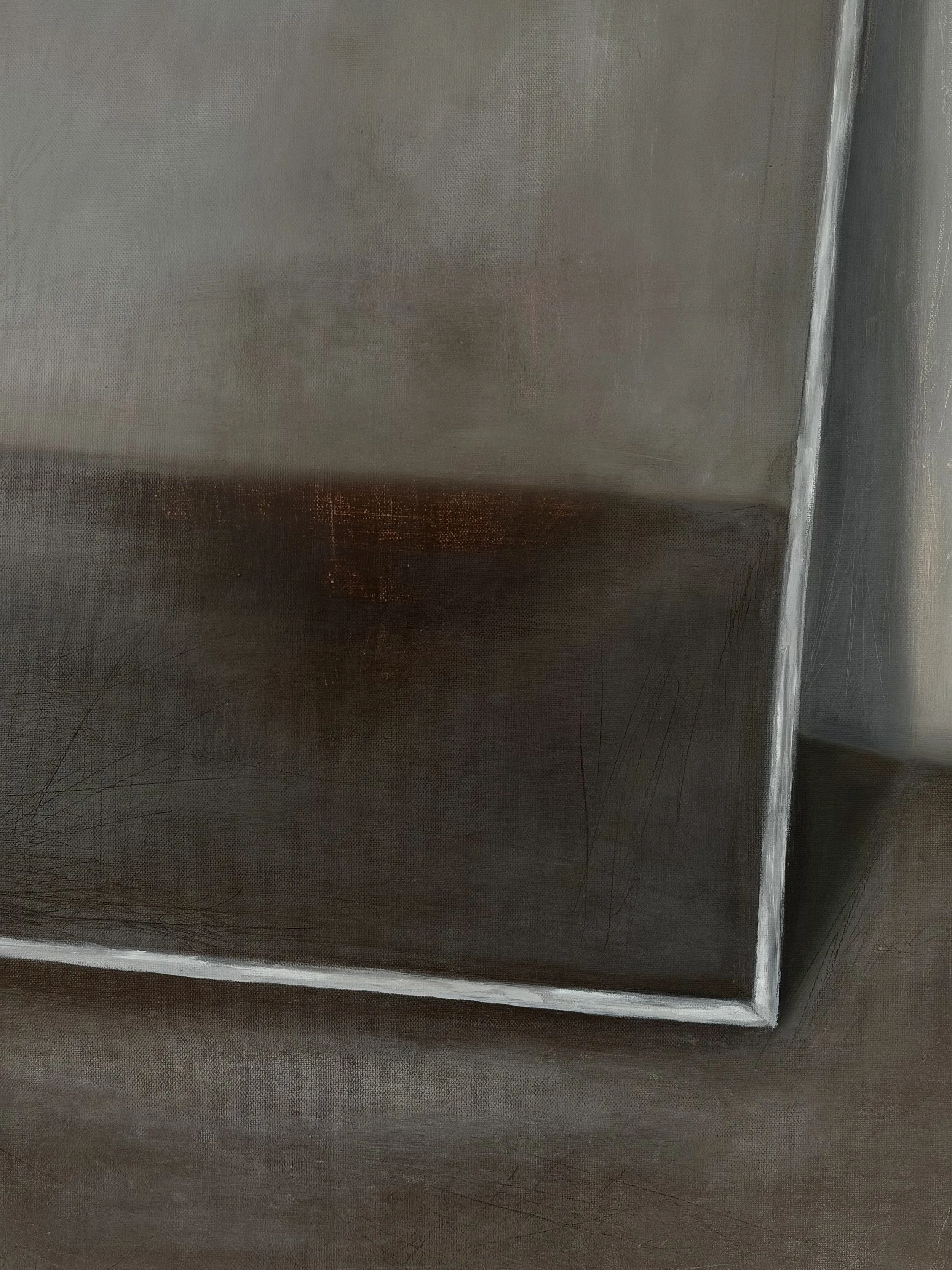 Close-up of a metallic surface with a white border along its edge.