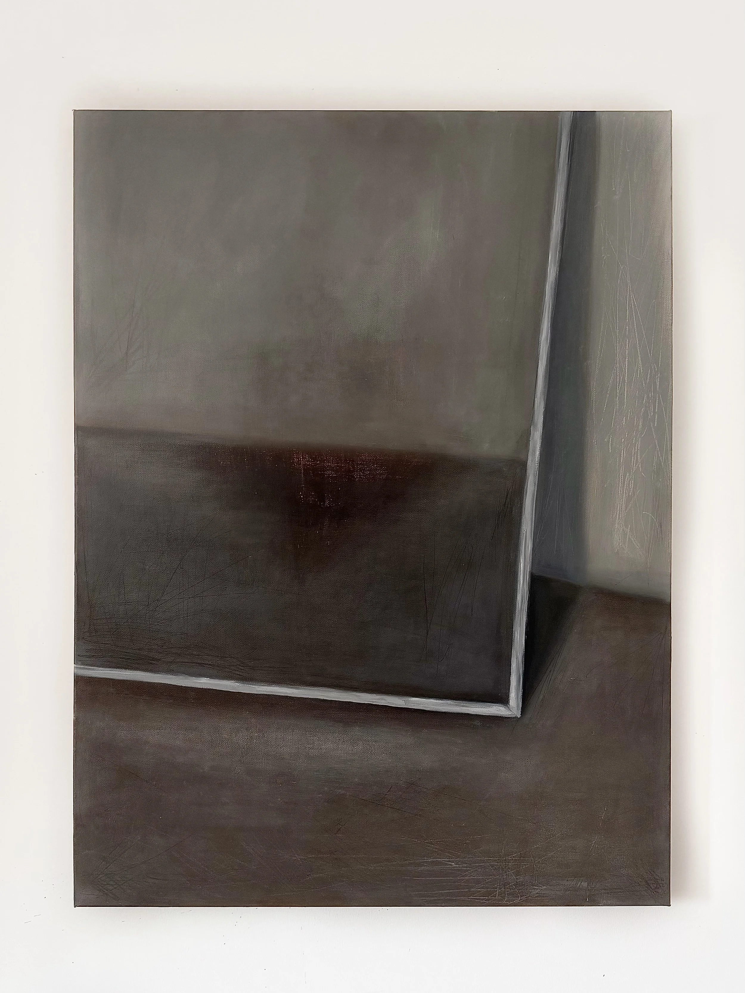 A metallic cuboid sculpture with a slightly tilted top surface, placed on a white background.