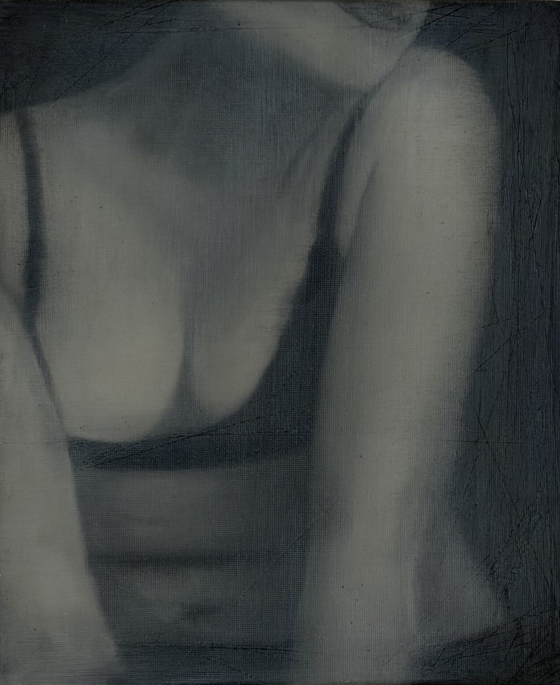 A close-up of a frayed and altered photograph, showing parts of a face with visible handprints, scratches, and texture overlay.