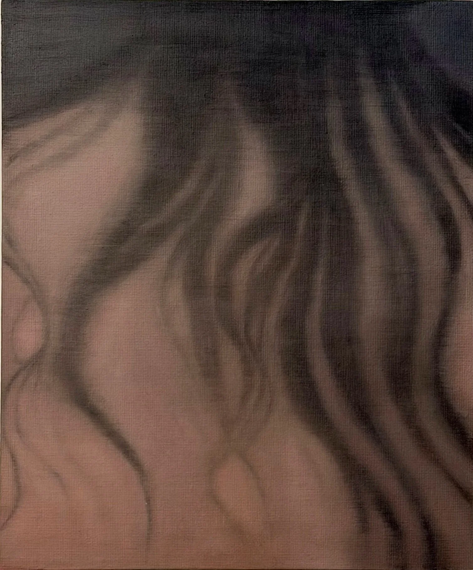 Close-up of a person's face with hair covering one eye, with a soft focus effect.