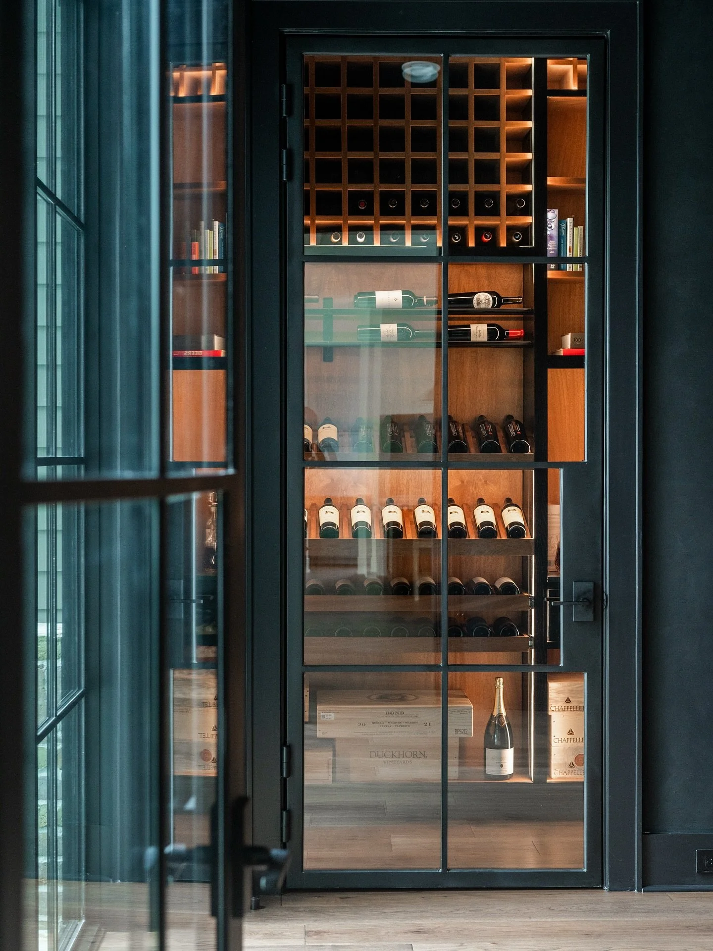 Saxon reveal part 4: The Wine Room 🍷

A moody little jewel box!!! Matte black, warm wood, and that soft perimeter glow that makes every bottle feel special. Storage for the everyday, display for the show-stoppers, and a glass door that turns the who