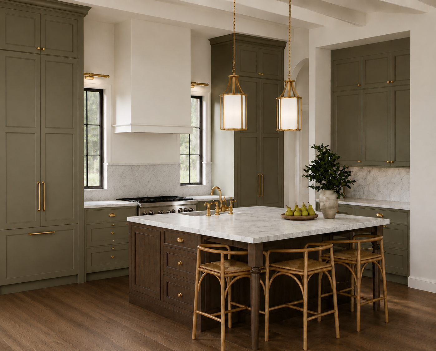 A modern kitchen with sage green cabinets, a central island with a marble countertop, and wooden bar stools. There is a pot of green plants, a tray of pears, and hanging pendant lights with gold accents. Two windows provide natural light, and a stove is set against the wall.