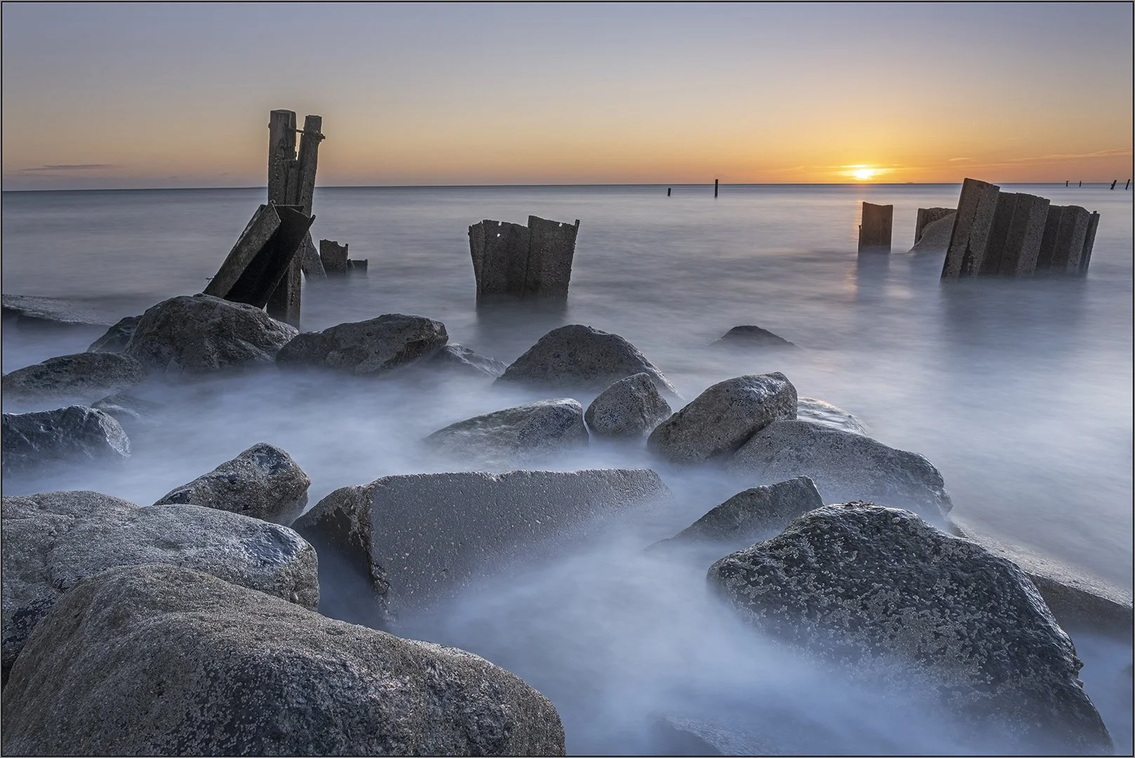 Eeroding sea defences at sunrise - Hazel Farrow