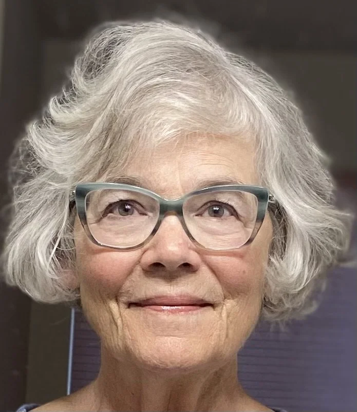 headshot-of-woman-short-grey-hair-glasses