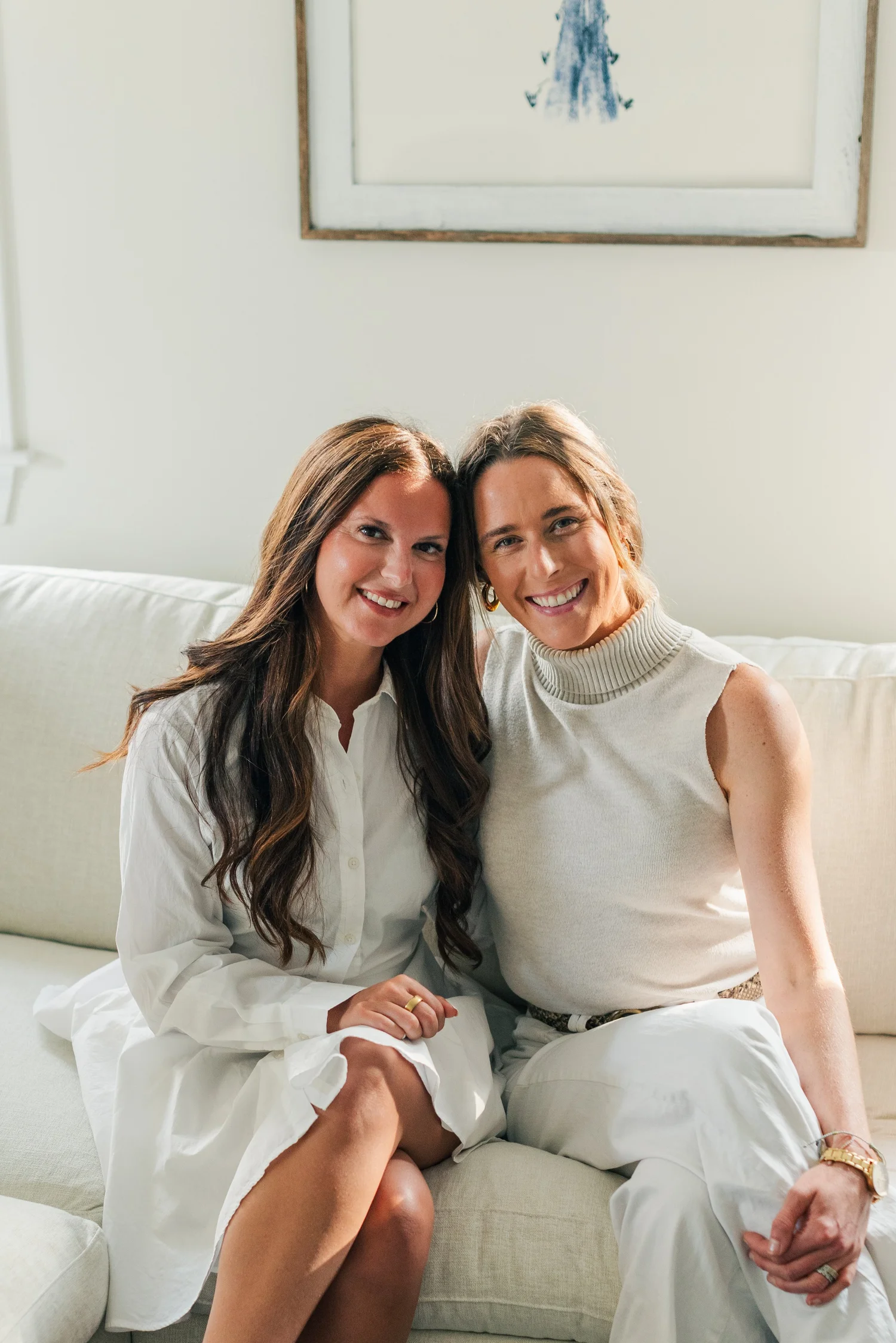 SOLEO’s two co-founders sitting together on a couch