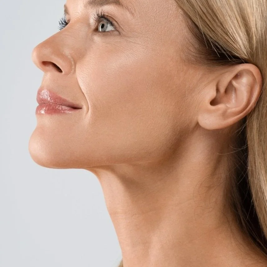 Profile of a woman with clear skin, looking upwards
