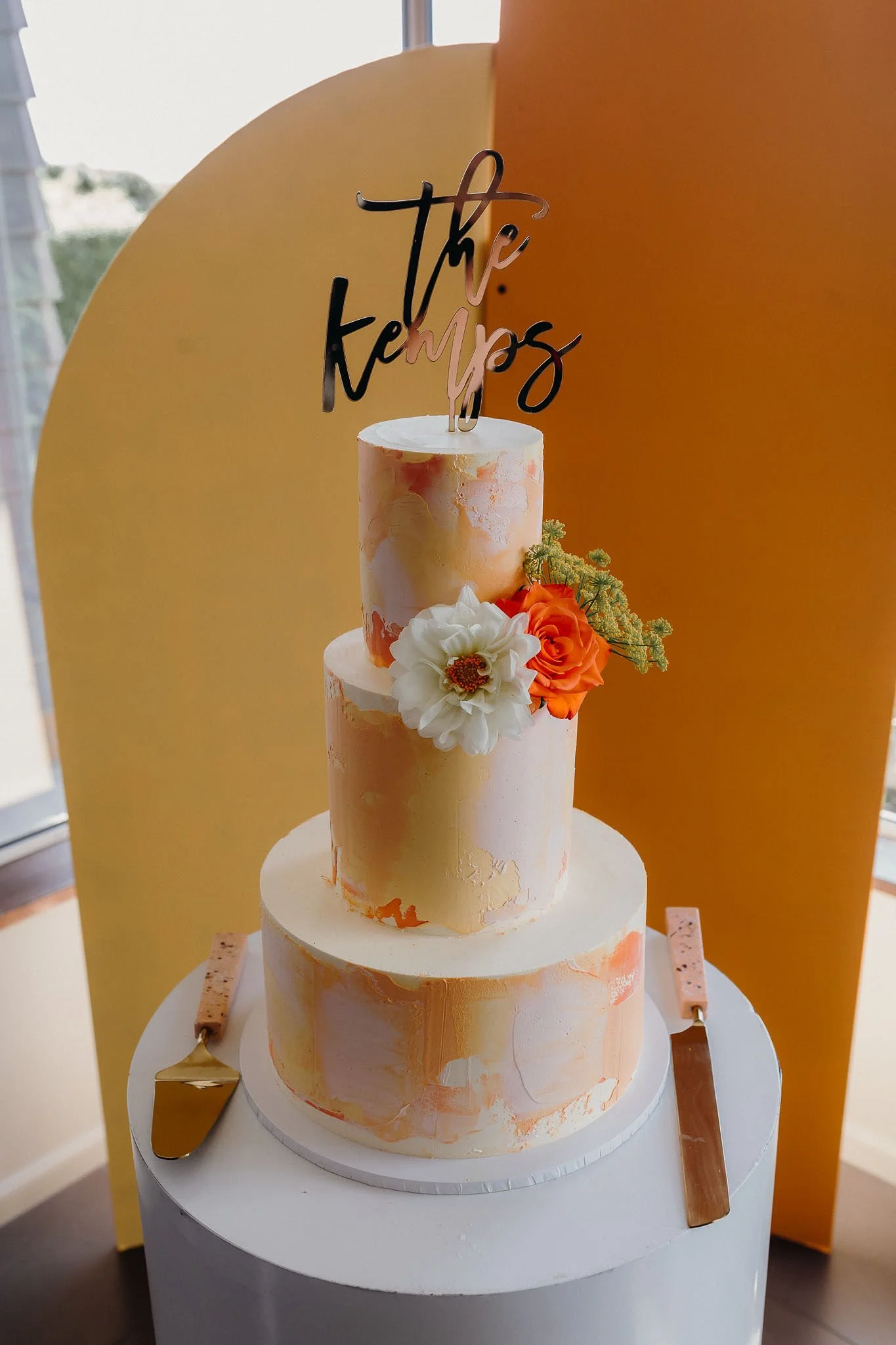 Wedding cake displayed with elegant styling during a reception at Waipuna Estate