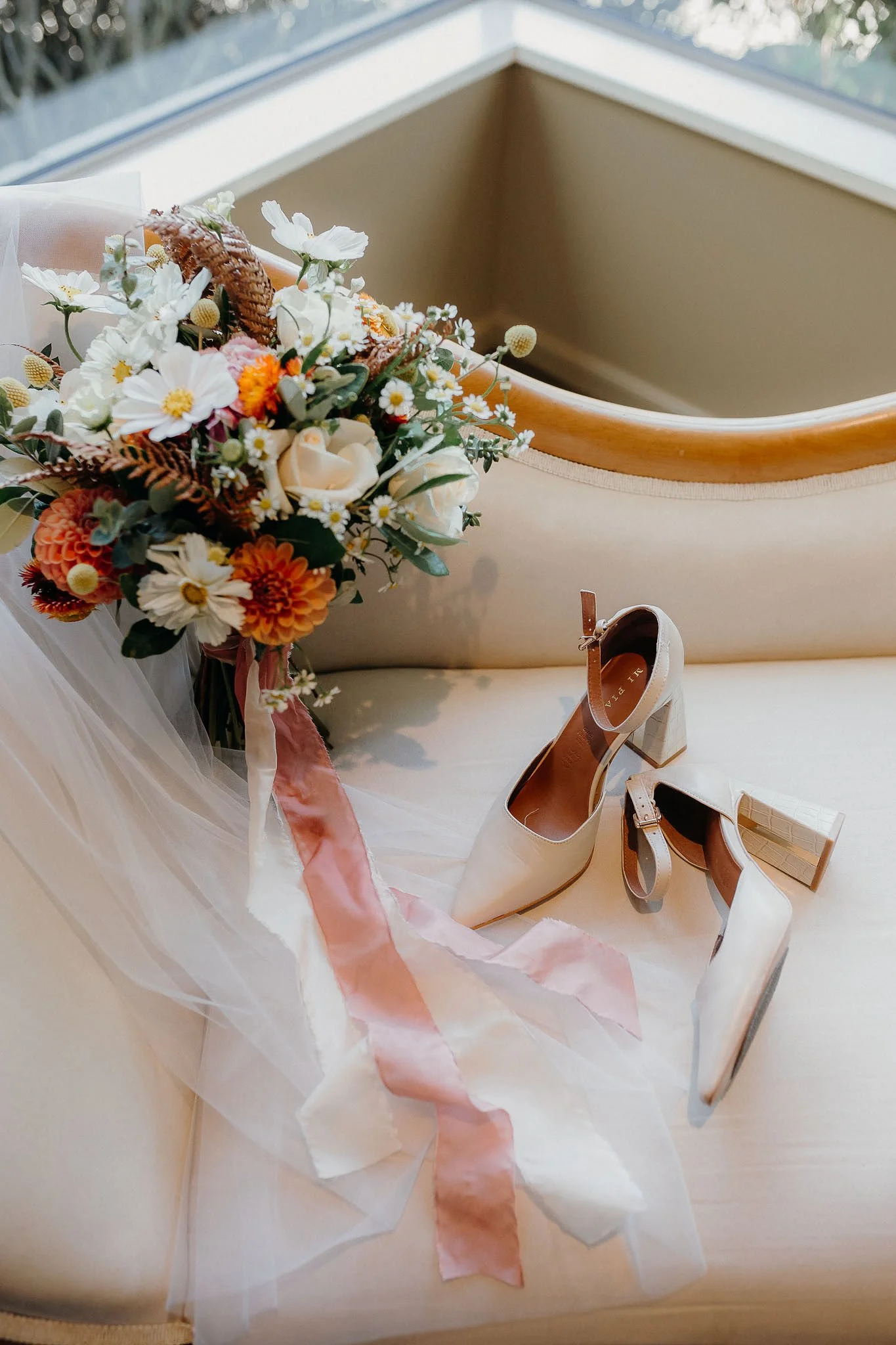 Comfy shoes ready for the bride to change into for the reception at Waipuna Estate