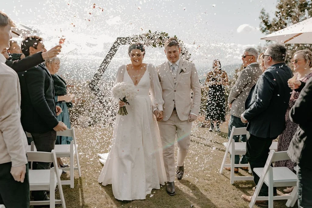 Couple celebrating their winter wedding ceremony with guests at Waipuna Estate in Canterbury