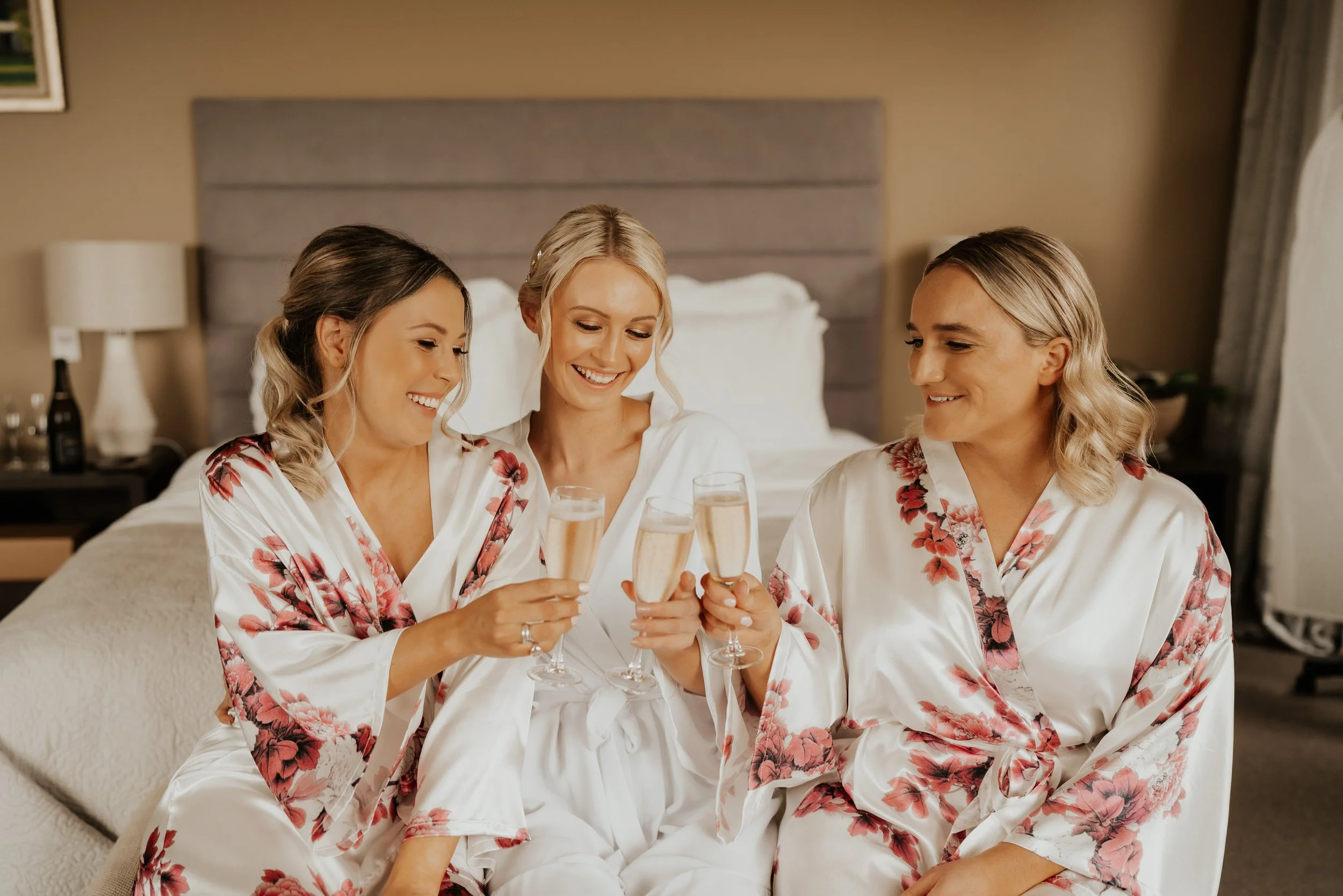 Bride enjoying a quiet moment with her bridal party before the wedding ceremony.