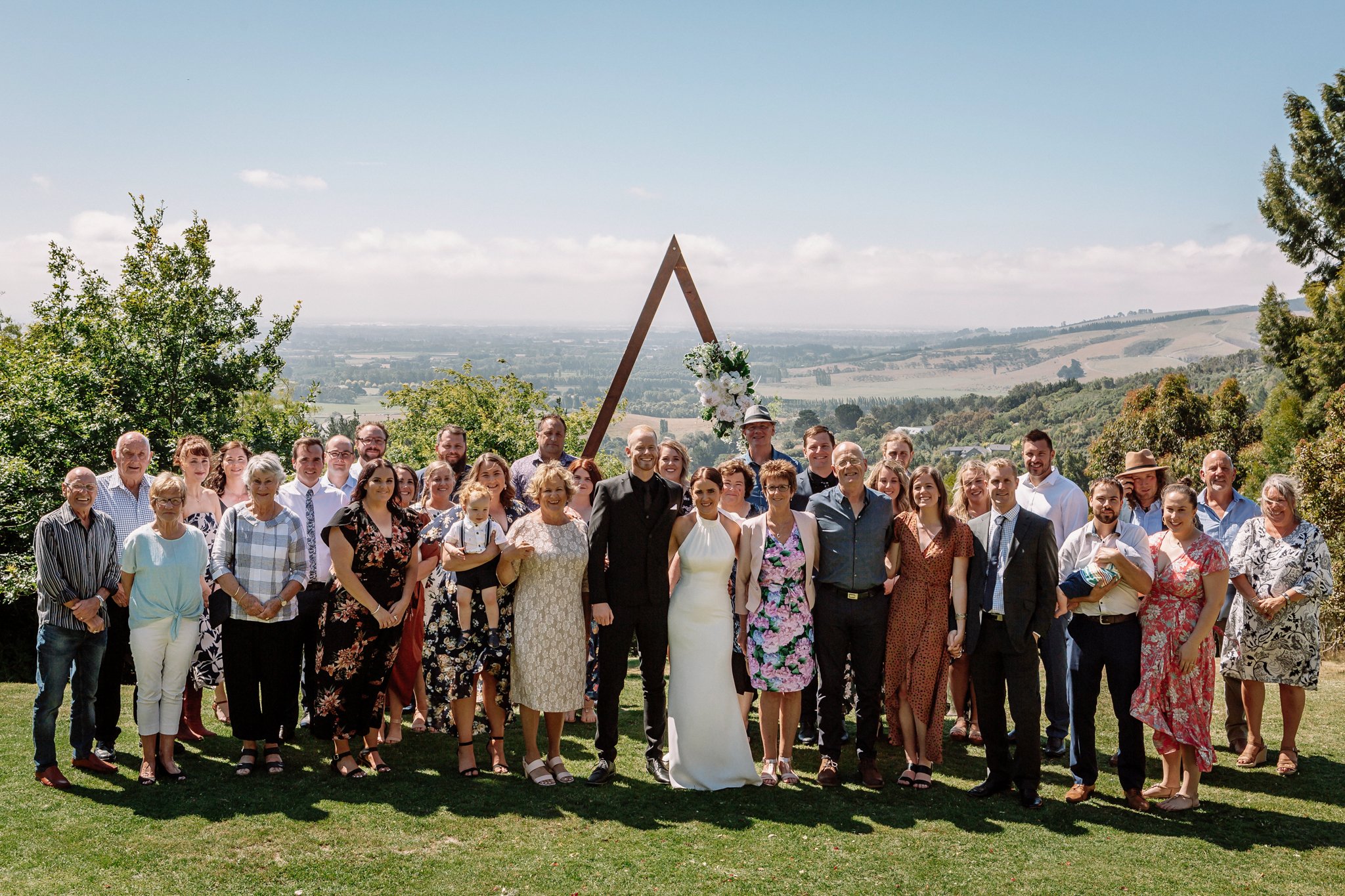 Bride and groom celebrating with close family and friends at Waipuna Estate