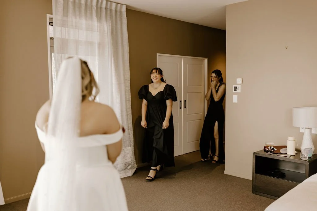 A joyful surprise wedding celebration at Waipuna Estate with excited guests and intimate moments