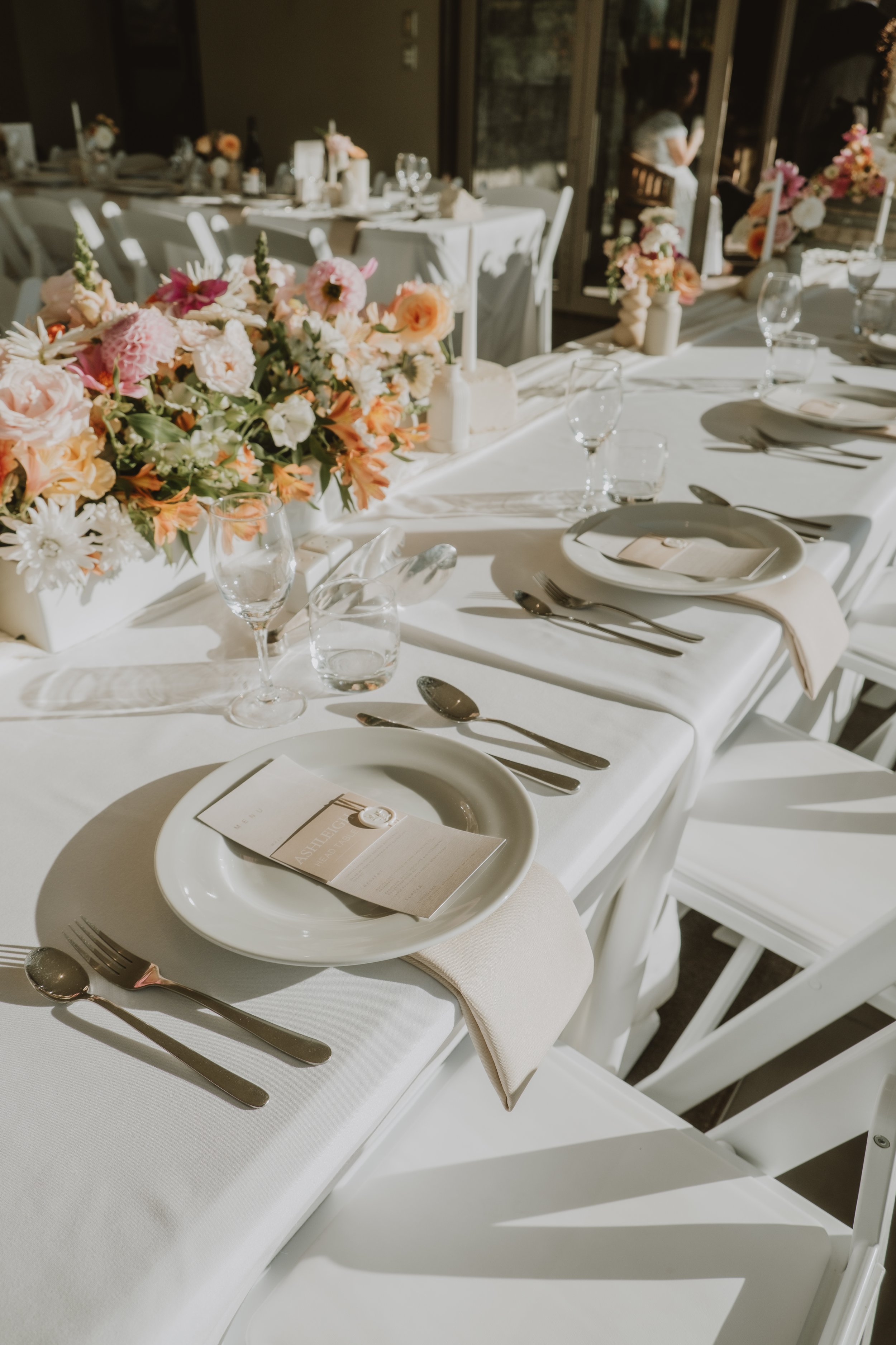 Wedding reception tables and styling details prepared before guests arrive at Waipuna Estate