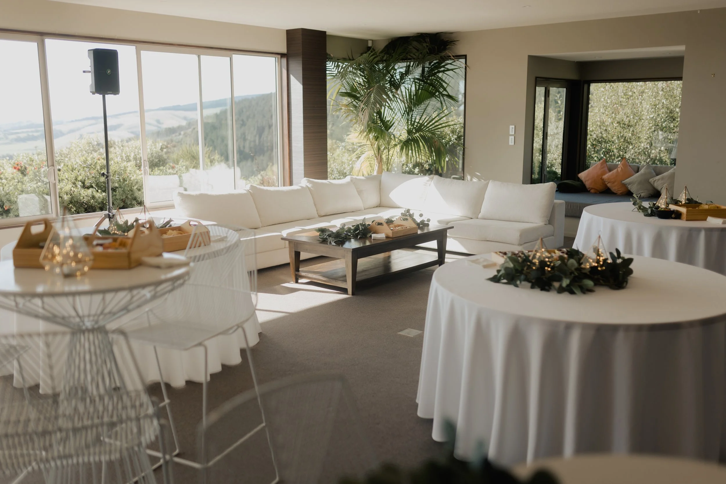 Beautifully styled wedding reception with elegant tables and décor at Waipuna Estate