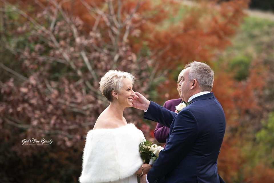 Bride wearing a faux fur wrap during a winter wedding at Waipuna Estate