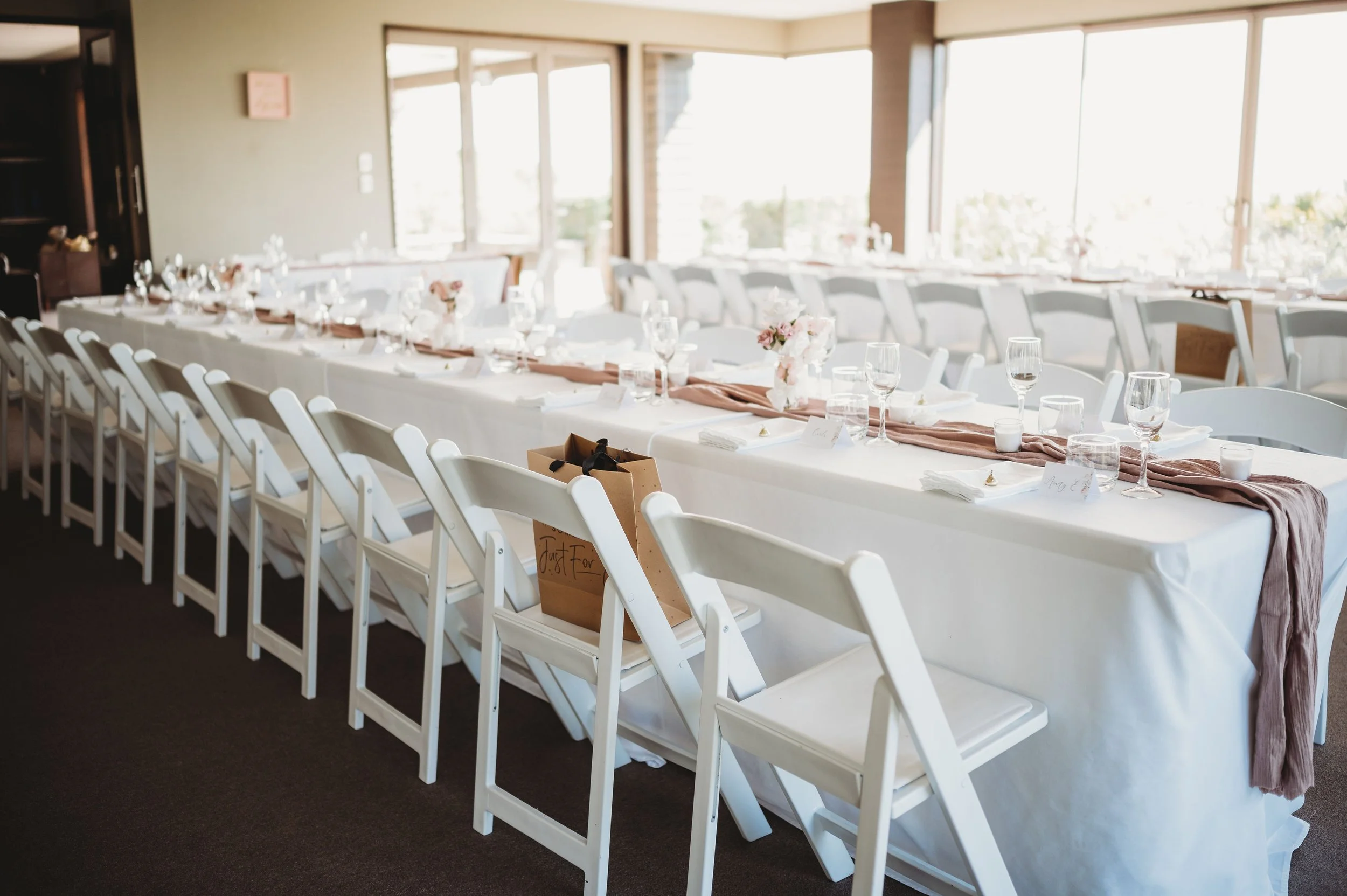 Elegant wedding reception table setting with personalised place cards and details at Waipuna Estate