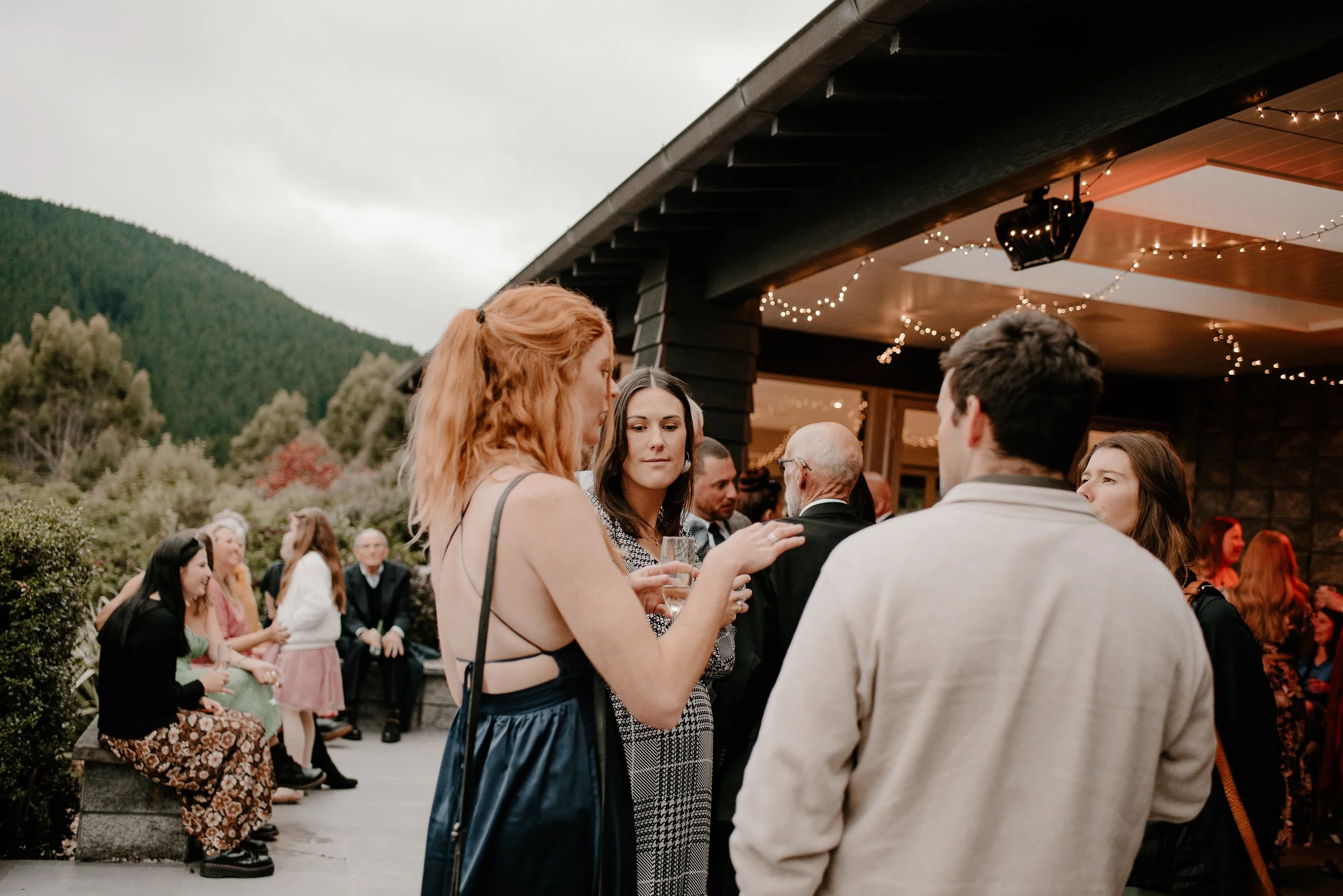 Guests enjoying cocktails with the breathtaking views of the Southern Alps and Canterbury Plains at Waipuna Estate