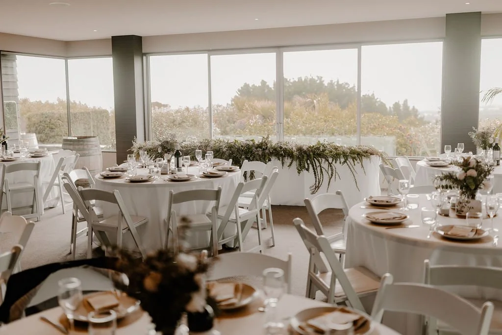 Beautifully styled reception space at Waipuna Estate ready for wedding guests