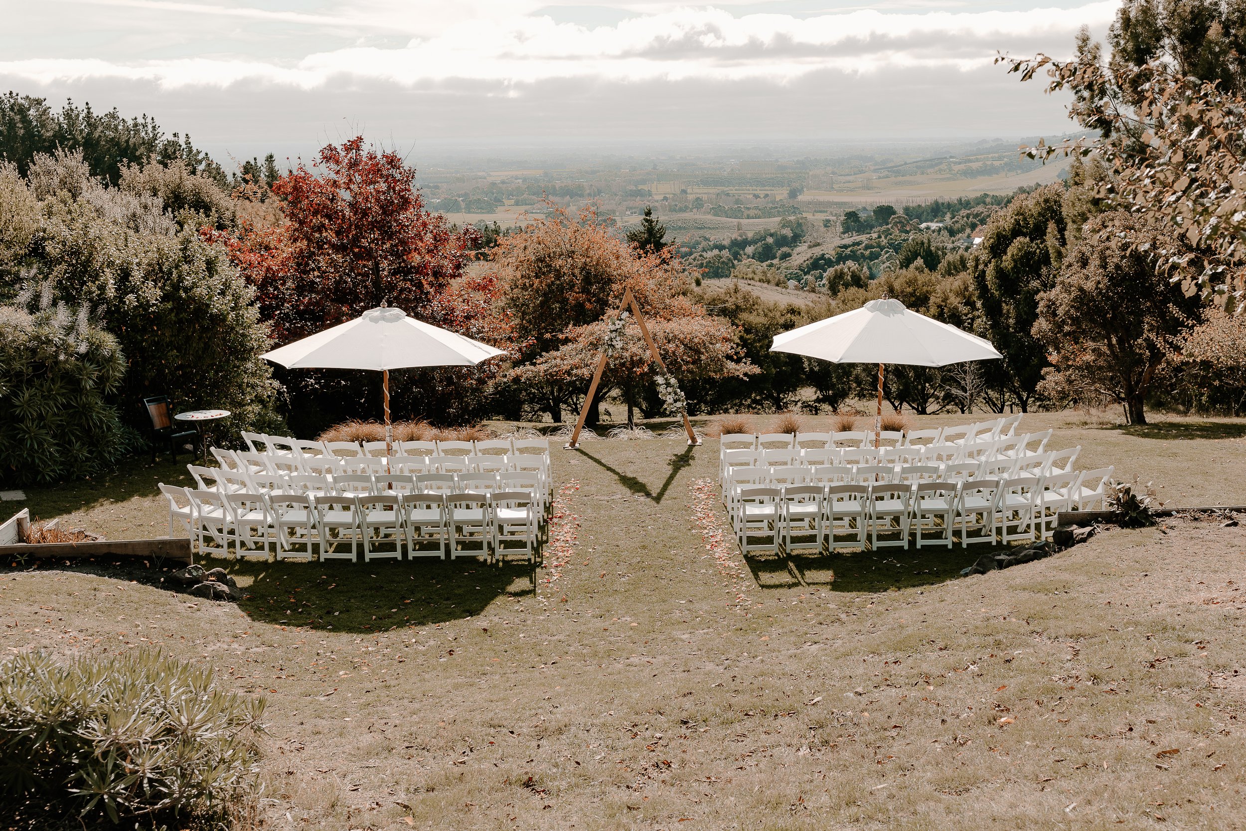 A beautifully styled wedding ceremony at Waipuna Estate showcasing priorities like décor, and atmosphere