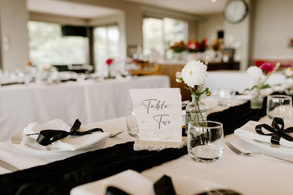 Styled wedding reception tables prepared for guests at Waipuna Estate