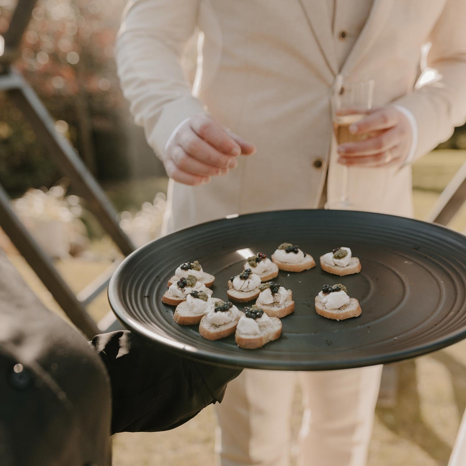 Guests enjoying wedding catering at Waipuna Estateering at W