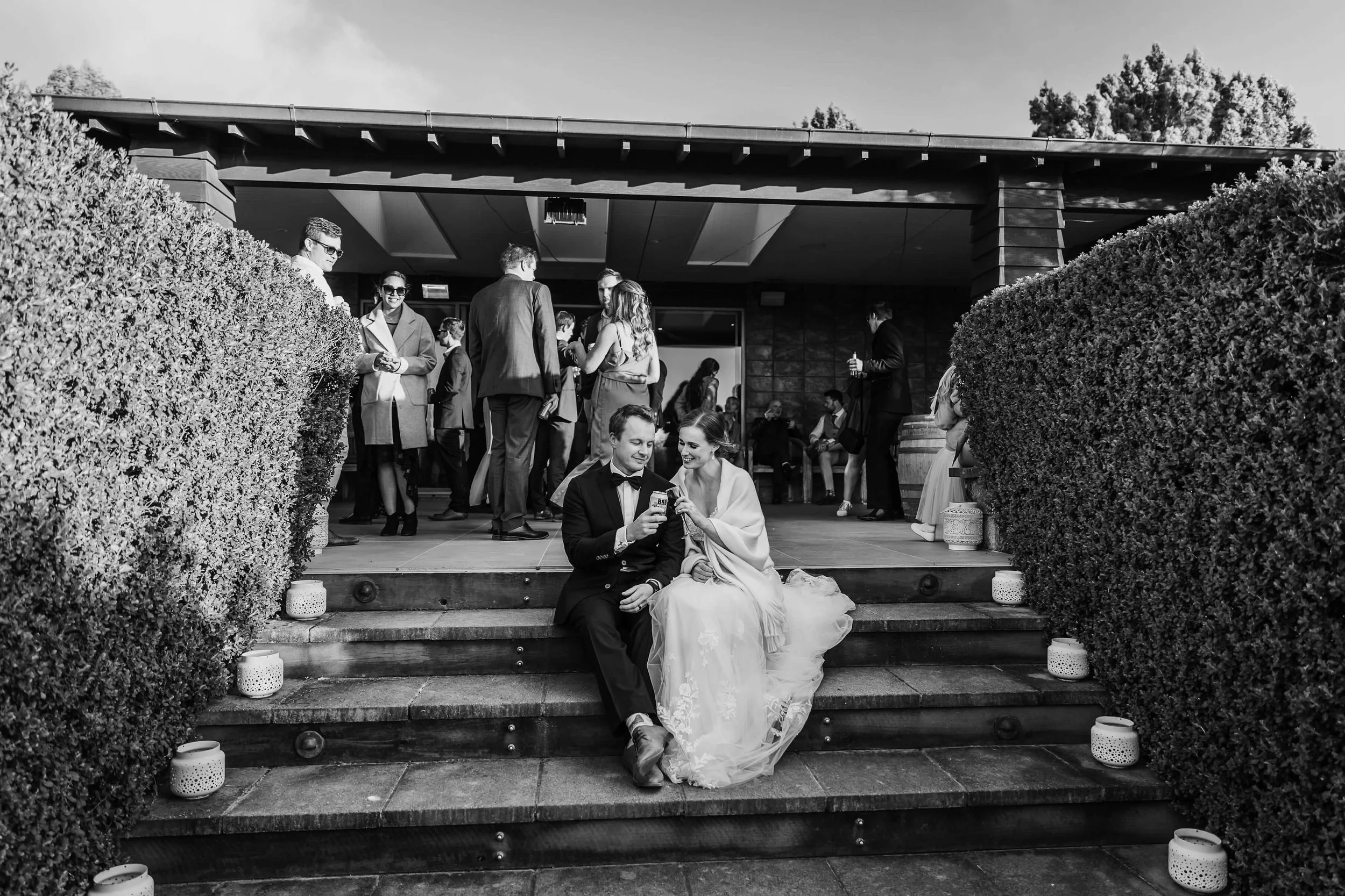 Couple relaxed and comfortable in their wedding outfits at Waipuna Estate