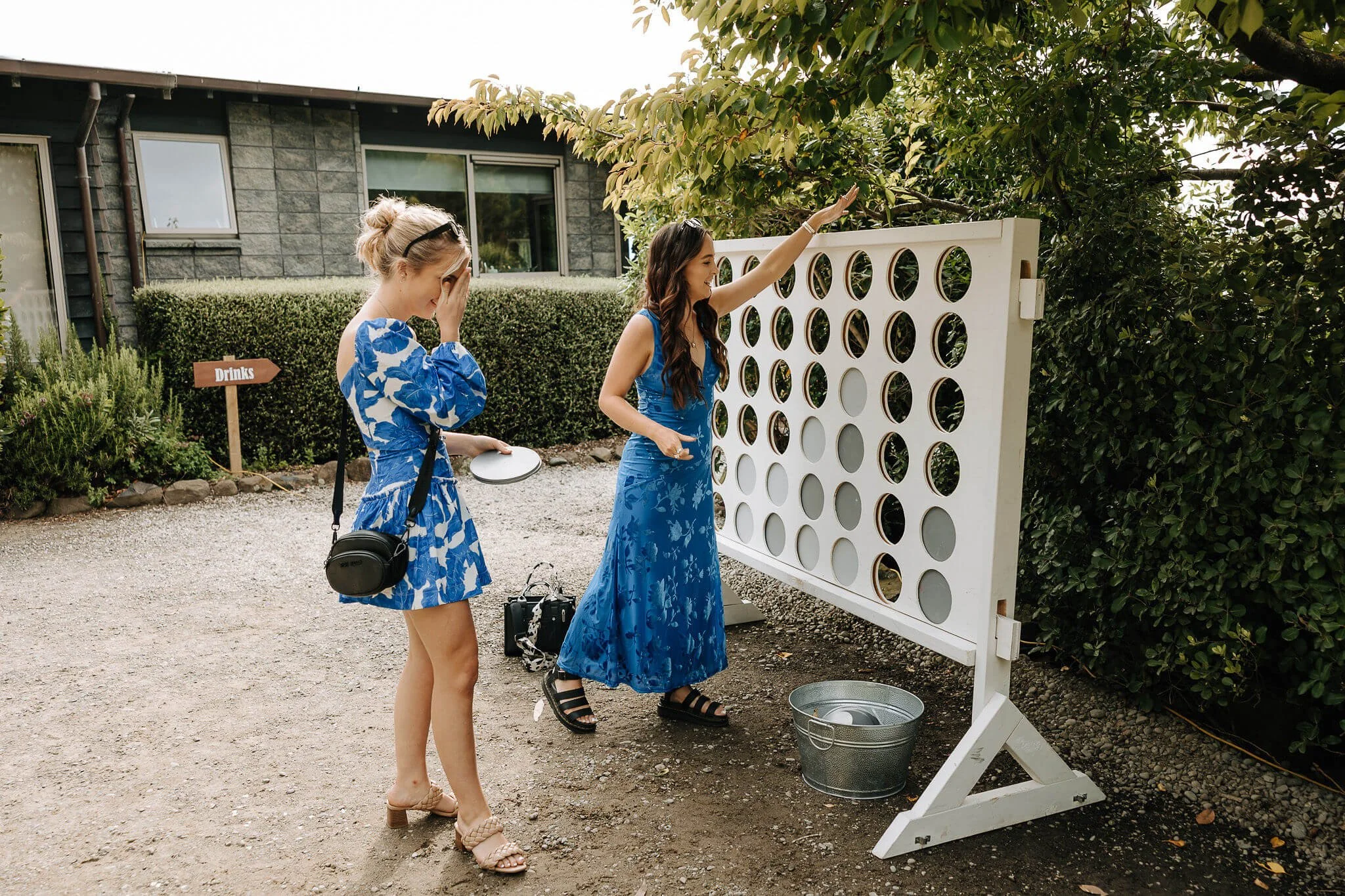 Wedding guests playing lawn games at Waipuna Estate reception