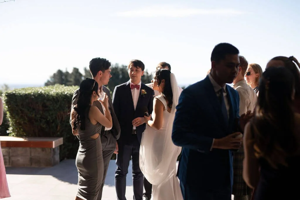 Bride and groom celebrating with family and friends during their wedding day.