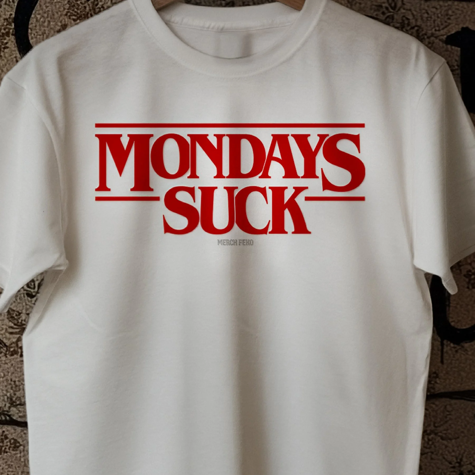 Mondays-Suck-Merch-Feko-White+Funny+Tee+T-Shirt-Closeup.jpg