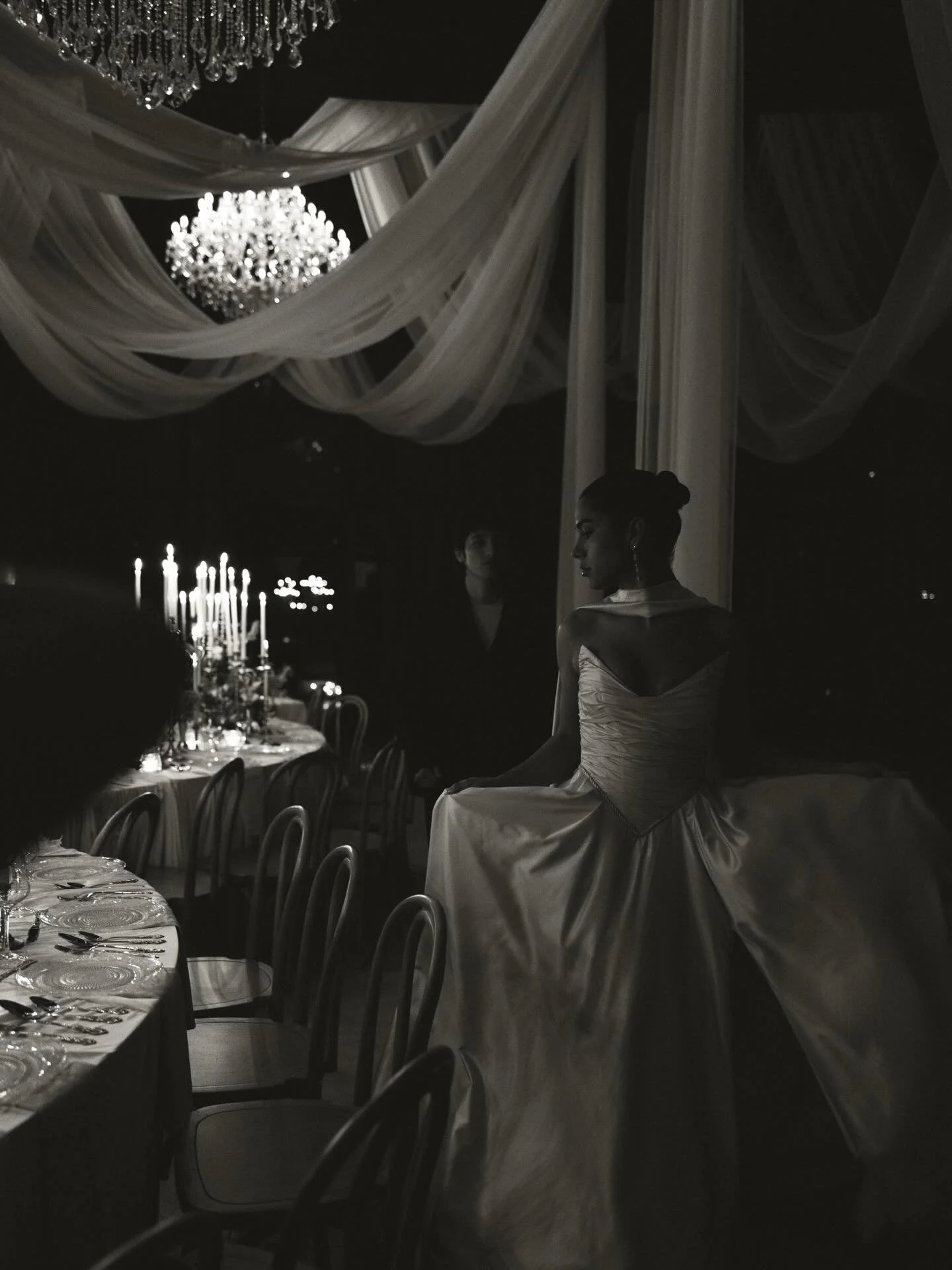 some moments just stay with you forever and this is one of them. consider this my petition for more moody, candlelit receptions in 2026 🤎 give me alllll the drama with candles, chandeliers, drapery, and elegant table details. given how ROMANTIC thes
