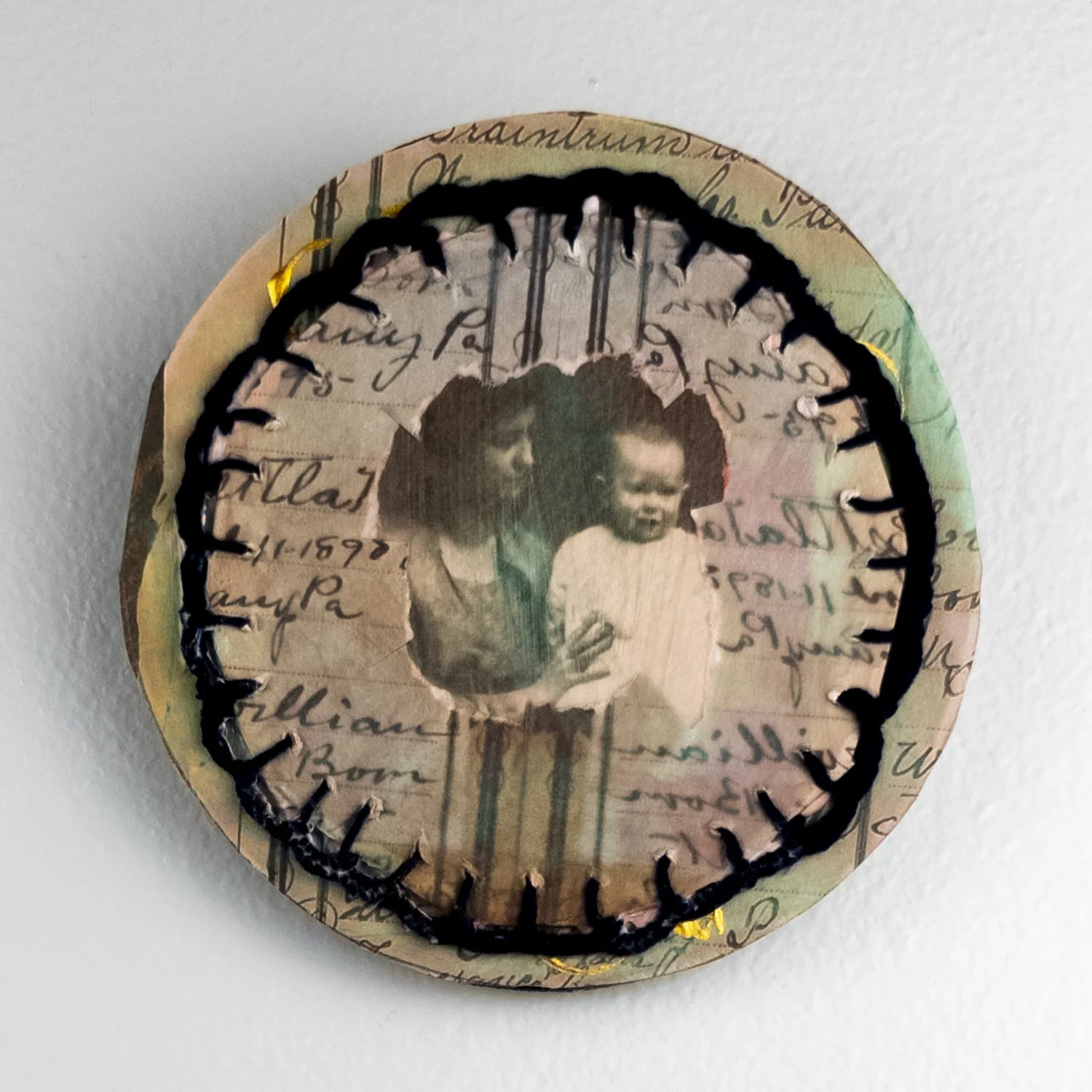   Through Her Eyes     Mixed Media Collage Attached to Wood  
4" x 4" circle  