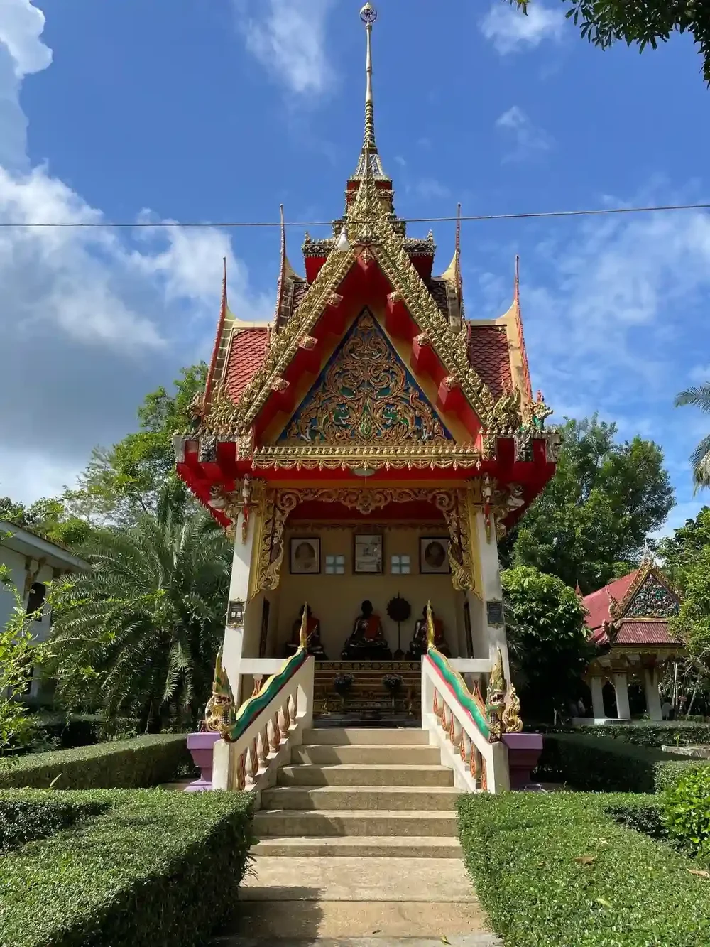 Travellers visiting a temple in Thailand