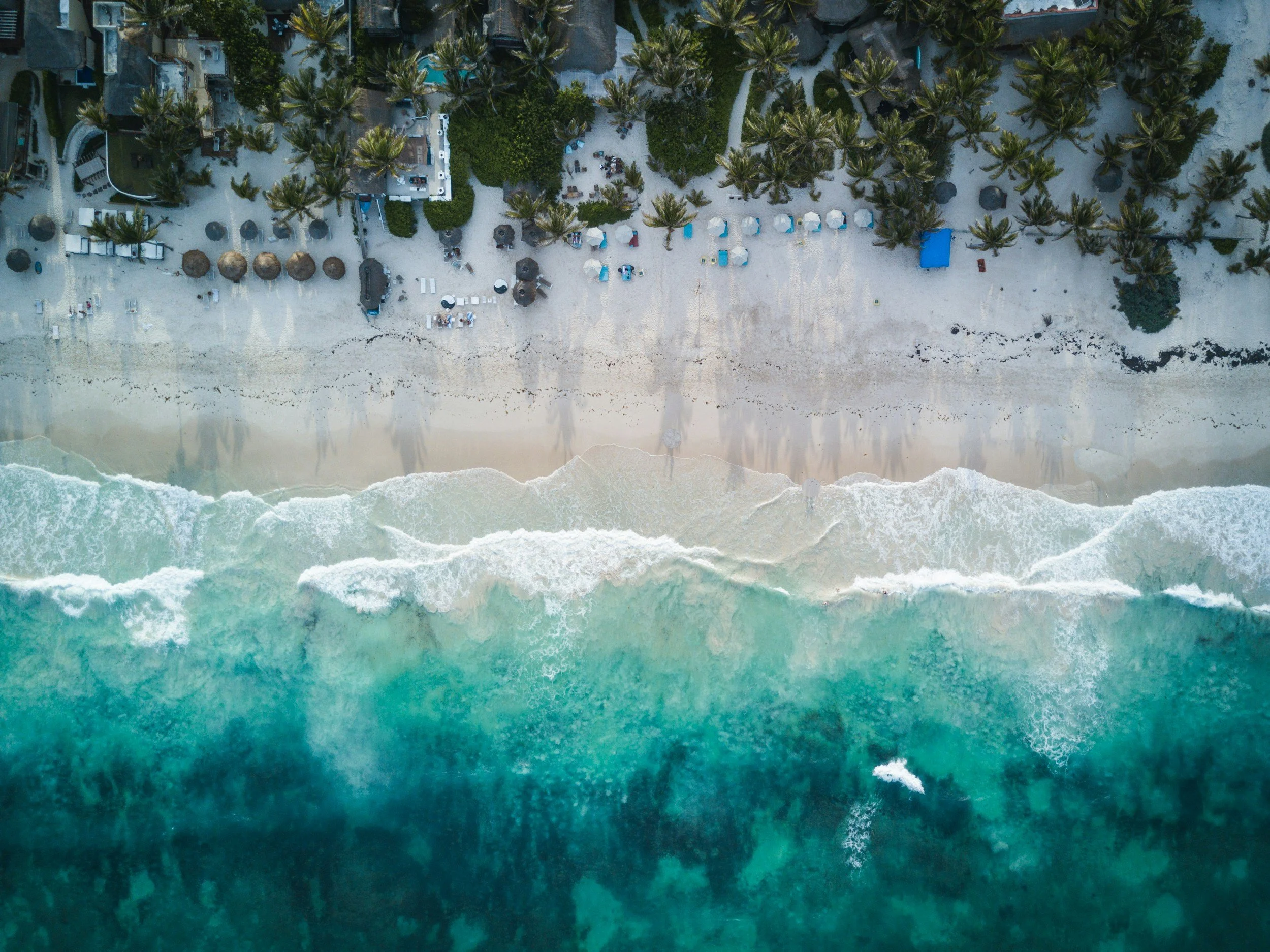 arial shot of beach and crashing waves
