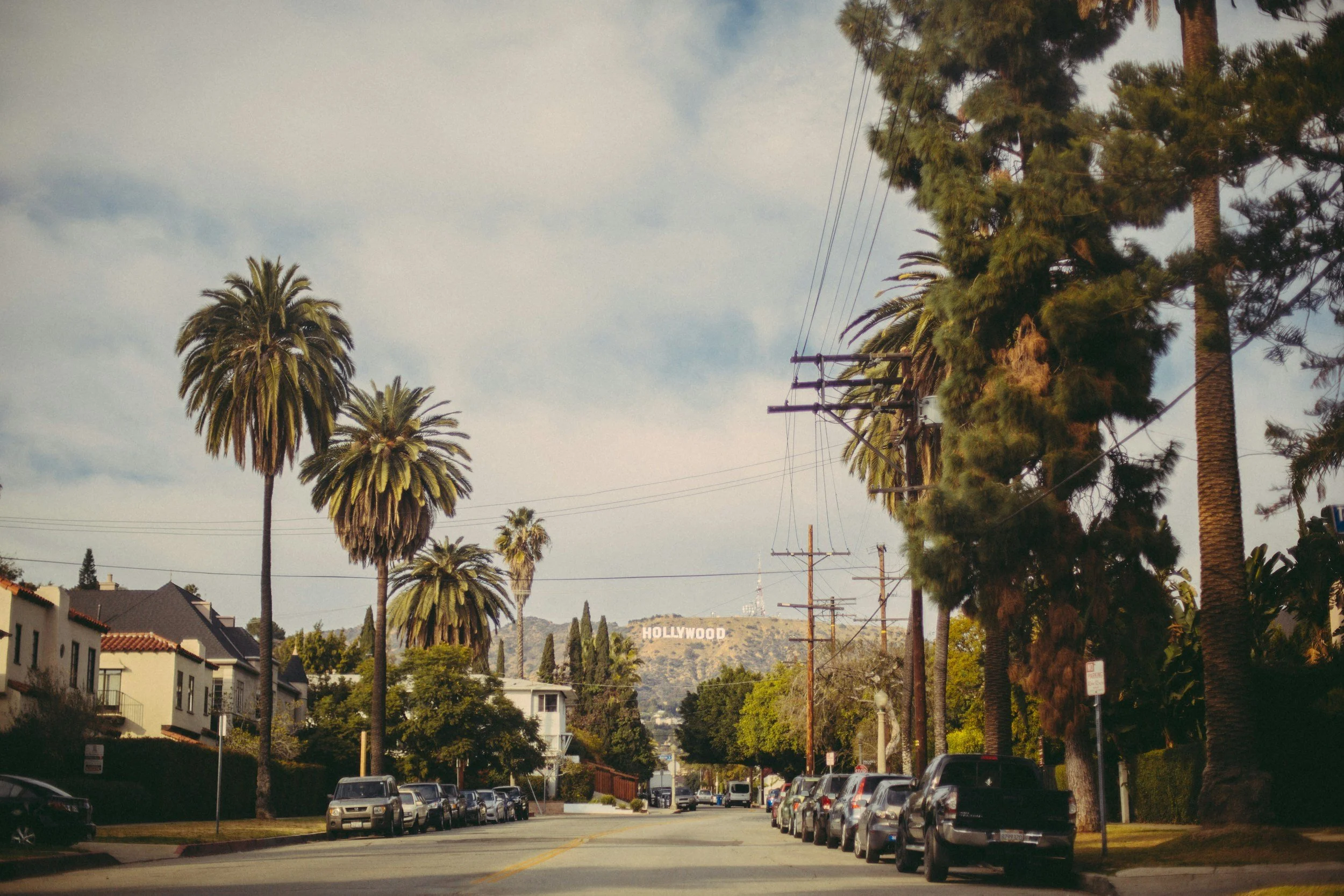 houses on street hollywood sign background